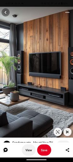 a living room filled with furniture and a flat screen tv on top of a wooden wall