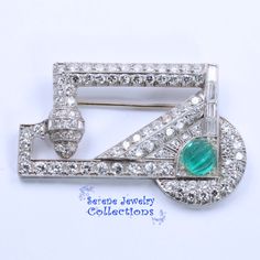 Thank you for coming in! Stunning delicately designed Art Deco style platinum brooch studded with 4.5 carats of various shaped diamonds! A carved melon glass green stone completes the piece! Weight: 13 grams Size: 1.8 inch x 1.2 inch Precious Metal: Platinum Precious stones: -Diamond Rounds: 4.5 carats total -Green Stone (Glass) Luxury Green Brooch For Anniversary, Luxury Green Brooches For Anniversary, Art Deco Diamond Brooches With Gemstone, Diamond Gemstone Brooches In Art Deco Style, Luxury Green Brooch Jewelry, Art Deco White Gold Brooch In Platinum, Art Deco Platinum Brooches In White Gold, Art Deco White Gold Platinum Brooches, Luxury Green Brooch For Formal Occasions