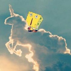 a spongebob kite flying in the sky with clouds behind it and an upside down figure