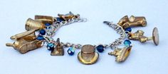 Gold Monopoly Token Charm Bracelet with Blue by HoneysuckleRoseC Gold Adjustable Novelty Charm Bracelet, Adjustable Gold Charm Bracelet Collectible, Adjustable Gold Charm Bracelet, Kansas City Mo, Horse Rider, Top Hat, Blue Beads, Charm Bracelets, Monopoly