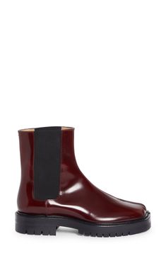 Inspired by the Japanese tabi sock, this iconic split-toe Chelsea boot is made from glossy calfskin leather and grounded on a grippy lug sole. 1 1/2" (38mm) heel; 1" platform (size 39) 6 1/2" shaft Pull-on style with elastic gore insets Leather upper and lining/rubber sole Made in Italy Designer Shoes Tabi Socks, Chelsea Boot Women, Maison Margiela Tabi, Margiela Tabi, Chelsea Boot, Lug Sole, Designer Shoes, Chelsea Boots, Calf Skin