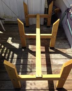 a wooden table sitting on top of a wooden deck