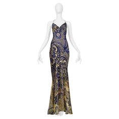 Resurrection Vintage is delighted to present a vintage Roberto Cavalli evening gown featuring a blue to yellow ombré batik print, slip dress neckline at front and cross straps at back, fitted body and mermaid dress flair at bottom, train at back, and dramatic evening gown length. * Roberto Cavalli * Size: I42 * Fabric: 100% Silk * 2005 Collection  * Excellent Vintage Condition * Authenticity Guaranteed Evening Gowns Gold, Vintage Roberto Cavalli, Roberto Dress, Roberto Cavalli Dress, Print Slip Dress, Strapless Ruffle Dress, Skull Dress, Evening Dresses With Sleeves, Vintage Versace