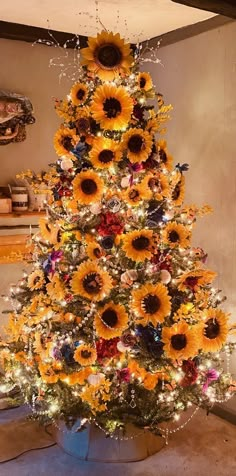 a decorated christmas tree with sunflowers on it