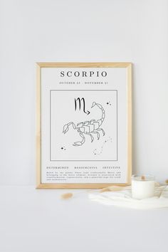 the scorpio zodiac sign is displayed next to a glass of milk