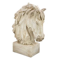 a white horse head on top of a wooden block in front of a white background