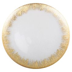 a white and gold plate on a white background