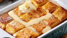 a casserole dish with cheese sauce being drizzled on top