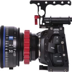 a camera with a lens mounted to it's body and attached to the side