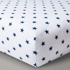 a white sheet with blue stars on it