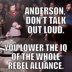 a group of people standing around a table with a quote on it that says, anderson don't talk out loud you lower the 10 of the whole audience