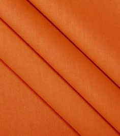 an orange fabric with very thin folds