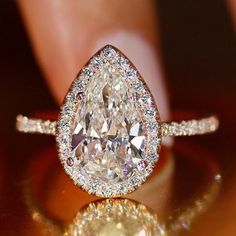 a close up view of a diamond ring with diamonds on the bottom and side stones