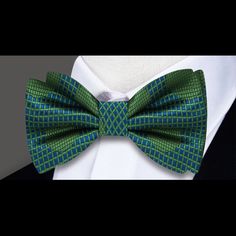 Dynamic Elegance: Blue and Green Polka Dots Silk Bow Tie Step into a world of vibrant sophistication with our Blue and Green Polka Dots Silk Bow Tie – a statement accessory that seamlessly blends classic charm with a playful twist. This bow tie isn't just an embellishment; it's a style statement that allows you to showcase your unique personality with flair. Join us as we explore the intricacies of this polka dots bow tie and discover how it can elevate your sartorial elegance. Polka Dot Panache Elegant Fitted Multicolor Bow Tie, Elegant Blue Bow Tie, Elegant Summer Party Bow Tie, Classic Green Bow Tie For Party, Blue Fitted Bow Tie For Party, Fitted Blue Bow Tie For Party, Blue Party Bow Tie, Elegant Green Bow Tie For Summer, Elegant Blue Bow Tie For Party