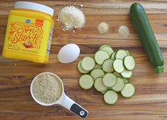 cucumbers, seasoning and other ingredients on a cutting board