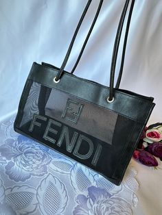 Authentic vintage Fendi mesh small tote bag Made in Italy Vintage Fendi mesh bag Size small ( rare find ) Professional authenticated Proof of authenticity can be provided upon request ( only serious buyers please) Pre-loved in good condition General signs of wear Hardware faded, hairline wear to leather trim , loosing color , aging on strap but still strong and functional Material softer , loosing shape Overall the bag is still in good condition with long life left Measurements W 29 H 19 D 12 cm Trendy Rectangular Mesh Bag, Trendy Rectangular Mesh Bags, Mesh Shoulder Bag For Shopping, Shopping Shoulder Bag With Mesh Lining, Mesh Tote Bag For Shopping, Everyday Mesh Tote Bag, Everyday Use Mesh Tote Bag, Shopping Tote Shoulder Bag With Mesh Lining, Mesh Tote Shoulder Bag With Mesh Lining