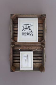 two wooden shelves with framed pictures on the top and bottom, one holding a fork and knife