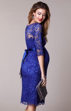 Rich and regal shades of Royal Blue lace meet the popular Amelia dress for a stunning maternity style perfect for any special occasion. Beautiful floral stretch lace lies over smooth soft stretch Royal Blue jersey for a style designed to stand out for all of the right reasons. Complete with a classic boat neck and discreet elbow length lace sleeves, this wonderfully wearable dress is perfect for a wedding, party, or red-carpet event. Sheer detailing adds subtle sassy drama for a look that wows. Blue Baby Shower Dress, Maternity Lace Dress, Surrogacy Journey, Rose Tiffany, Maternity Wedding Dresses, Lace Dress Short, Blue Maternity Dress, Business Dress Women, Royal Theme