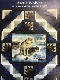 an image of two wolfs in the snow on a quilted wall hanger