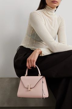 Valextra's 'Iside' mini tote is an icon in its own right, with its distinctive structure and compact size. Crafted in Italy from blush textured-leather, this one has an internal pocket to safely store your most-used belongings and studs at the base to prevent scratches. Attach the strap and wear it cross-body on busier days. Valextra Bag, Valextra Iside, Pastel Bags, Designer Things, Beautiful Wardrobe, Fashion Wishlist, Classic Fashion, Mini Tote, Net A Porter