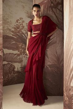 Marsala red ruffle pre stitched saree with bead and crystal embellished border. Comes with embellished blouse and belt.
Components: 3
Pattern: Embroidered
Type Of Work: Sequin,Crystal
Neckline: Square
Sleeve Type: Half
Fabric: Blouse: Net, Saree: Chiffon 
Color: Red
Other Details: 
Fit and flare silhouette
Occasion: Cocktail,Reception,Sangeet - Aza Fashions Desi Prom, Red Sequin Blouse, Red Indian Outfit, Red And White Saree, Pre Stitched Saree, Saree Chiffon, Saree With Belt, Ruffle Sarees, Stitched Saree