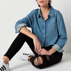 This Arizona women's and junior's denim button-down shirt brings a modern twist to a timeless piece. Made from a chambray cotton-blend for a regular-fit, it has a point collar, a chest slip pocket, and long cuffed sleeves. Wear it with distressed jeans and sneakers for a cool, laid-back look. Features: Accessory PocketClosure Type: ButtonFit: Regular FitNeckline: Collar NeckPockets: 1 Chest Slip PocketSleeve Length: Long SleeveSleeve Style: Cuffed SleeveApparel Length: 18.75 InchesFiber Content… Casual Blue Button-up Cropped Shirt, Denim Button Down, Button Front Shirt, Shirt Accessories, Cuff Sleeves, Distressed Jeans, Shirt Color, Chambray, Women Long Sleeve