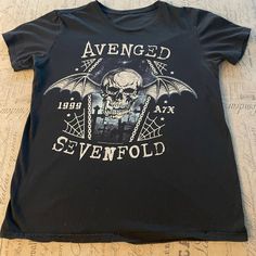 Avenged Sevenfold - 2015 Death Bat Skull T-Shirt Brand: ?? Cut Tag Color: Black Size: Men’s Medium Condition: Gently Used - Good - One Small Pinhole On Back. Please Note: Color May Vary Slightly Due To Screen And Lighting. All Items, Unless Marked Nwt, Are Gently Used And May Have Signs Of Wear. These Items Are 20-40 Years Old And Are Vintage!!! We Try To Call Out Any Flaws/Imperfections In The Description. Please View All Photos For Condition And Feel Free To Message Me For More Pictures Or Mea Bat Skull, Avenged Sevenfold, Skull T Shirt, T Shirt Brand, Skull Tshirt, Shirt Brand, Band Tees, 40 Years, Bat