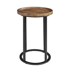 a round wooden table with metal legs and a black frame around the top, against a white background