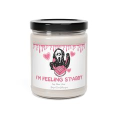 i'm feeling stabby soy candle in a jar with black lid on white background