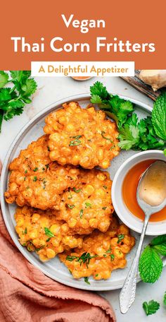 vegan thai corn fritters on a plate with dipping sauce and parsley