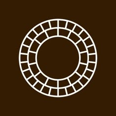 a white circle on a brown background that is made up of squares and rectangles