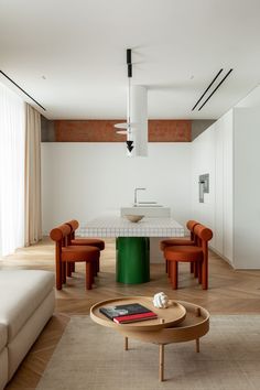 a living room filled with furniture and a table