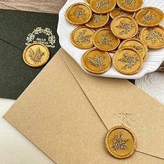 a bunch of cookies sitting on top of a table next to an envelope and some cards