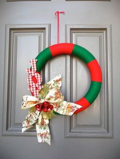 a christmas wreath hanging on the front door