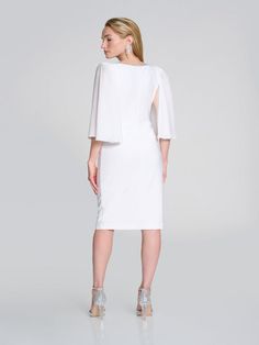 Elevate your wardrobe with this knee-length shift dress, featuring a flattering v-neck and feminine bell sleeves. Perfect for both casual and semi-formal occasions, this dress exudes elegance and style. The plain pattern allows you to accessorize with your favorite jewels, making it a versatile addition to your wardrobe. Sequin Collar, Denim Sweater Jacket, Kate And Pippa, Midnight Blue Color, Mac Jeans, Leggings Hoodie, Statement Sleeves, Dresses Royal, Knit Wrap