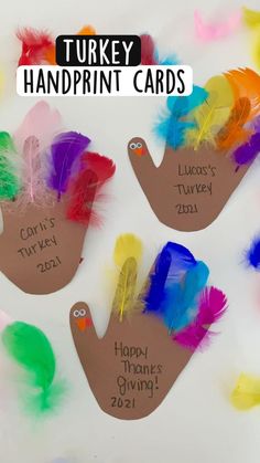 turkey handprint cards with colorful feathers on them