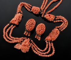 "Stunning Chinese export salmon coral sterling necklace and earrings set C 1920. 5 salmon coral plaques are prong set in custom made sterling frames. The plaques are meticulously hand carved with centuries old traditional Chinese fruit and leaves motif. They are connected with 3 swags of strung coral beads. The back of the necklace has 2 swags. The necklace is 17\" around neck. Front plaque measures 1\" X 7/8\" The 2 middle plaques are approx. 1 1/8\" long, the 2 top ones are approx. 3/4\" long. Chinese Fruit, Phoenix Jewelry, Miriam Haskell Jewelry, Abstract Jewelry, Vintage Jewelry Sets, Art Earrings, Chinese Export, Sterling Necklaces, Coral Jewelry