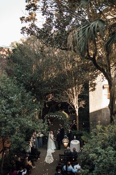 a couple getting married in an outdoor ceremony