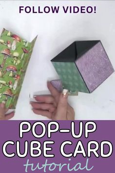 someone is holding an origami cube with the text pop - up cube card