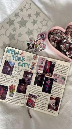 an open new york city scrapbook with pictures and stickers