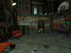 an empty basketball court with graffiti on the walls and benches in front of a jail cell