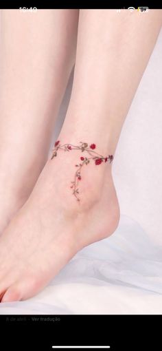 a woman's foot with flowers on it