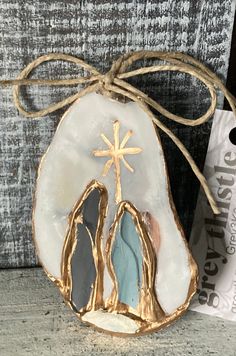 a white and gold shell with a cross on it