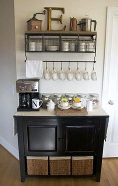 a coffee bar with cups and mugs on it