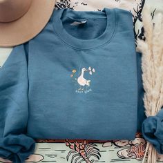 Quack up your style with this utterly silly goose sweatshirt! Embrace your playful side with our feather-soft, cozy sweatshirt featuring a charmingly goofy goose design. Perfect for those who love a touch of whimsy in their wardrobe. This sweatshirt isn't just for the birds--it's for trendsetters who aren't afraid to stand out and spread some lighthearted fun. Get ready to waddle around in comfort and style! Details These garments are made from polyester and cotton. This combination helps design Cute Cotton Crew Sweatshirt, Cute Cotton Crew Neck Sweatshirt, Comfortable Cotton Sweatshirt With Screen Print, Cute Cotton Crew Neck Tops, Goose Sweatshirt, Funny Boss Gifts, Goose Design, Boss Lady Mug, Boss Humor