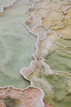 the water is green and brown with some white stuff on it's sides, as seen from above