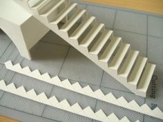 a paper model of a staircase on a table