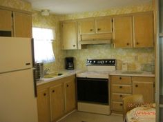 a kitchen with wooden cabinets and white appliances