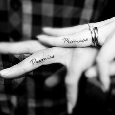 two people with matching rings on their fingers are holding hands that say promise and promise