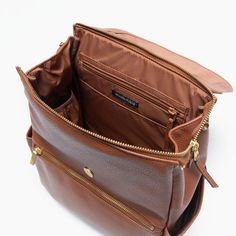 Cognac Mini Classic Bag II Mini Classic Diaper Bag II Diaper Bag Functional Everyday Brown Bags, Commuting Softback Bag With Zipper Pocket, Functional Brown Satchel For Everyday, Brown Standard Backpack Diaper Bag, Functional Leather Diaper Bag With Adjustable Strap, Brown Standard Backpack Diaper Bag For On-the-go, Everyday Brown Leather Diaper Bag, Brown Diaper Bag Backpack For Travel, Brown Diaper Bag Backpack For On-the-go